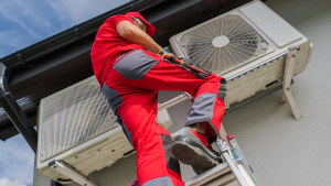 A professional technician from Fast Air Conditioning Repair on a ladder inspecting an outdoor A/C unit to diagnose the source of a loud buzzing or humming noise.